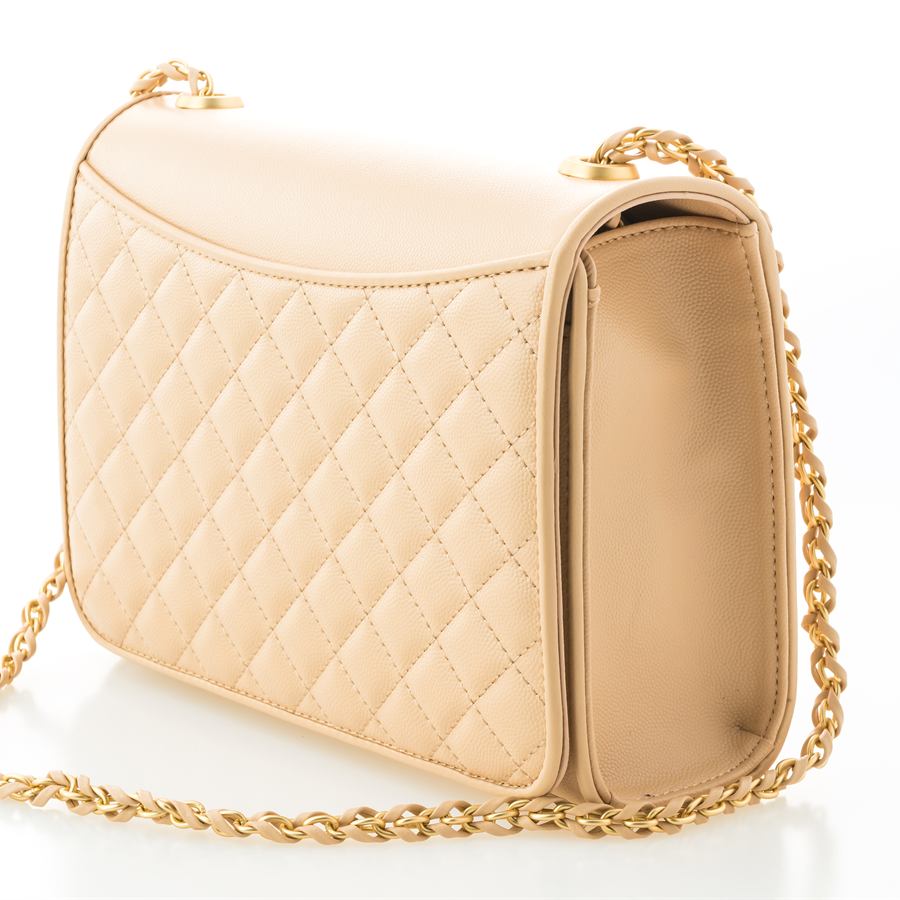 Sand coloured quilted leather shoulder bag with a gold and leather chain strap